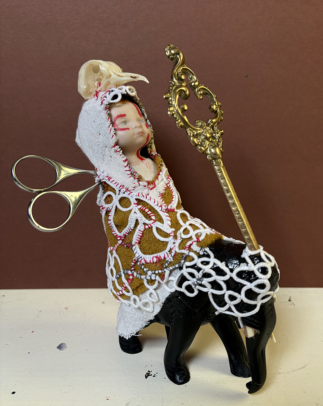 Deity talisman for the guidance with transformation, made from found objects, fabric, clay and ceramic doll - approx. 24 x 10 x 10 cm